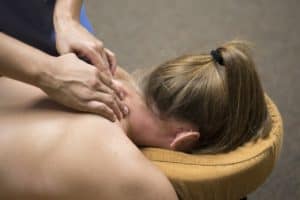woman getting neck massaged