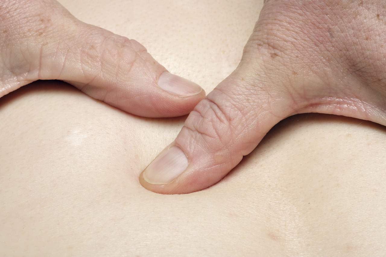 fingers massaging body