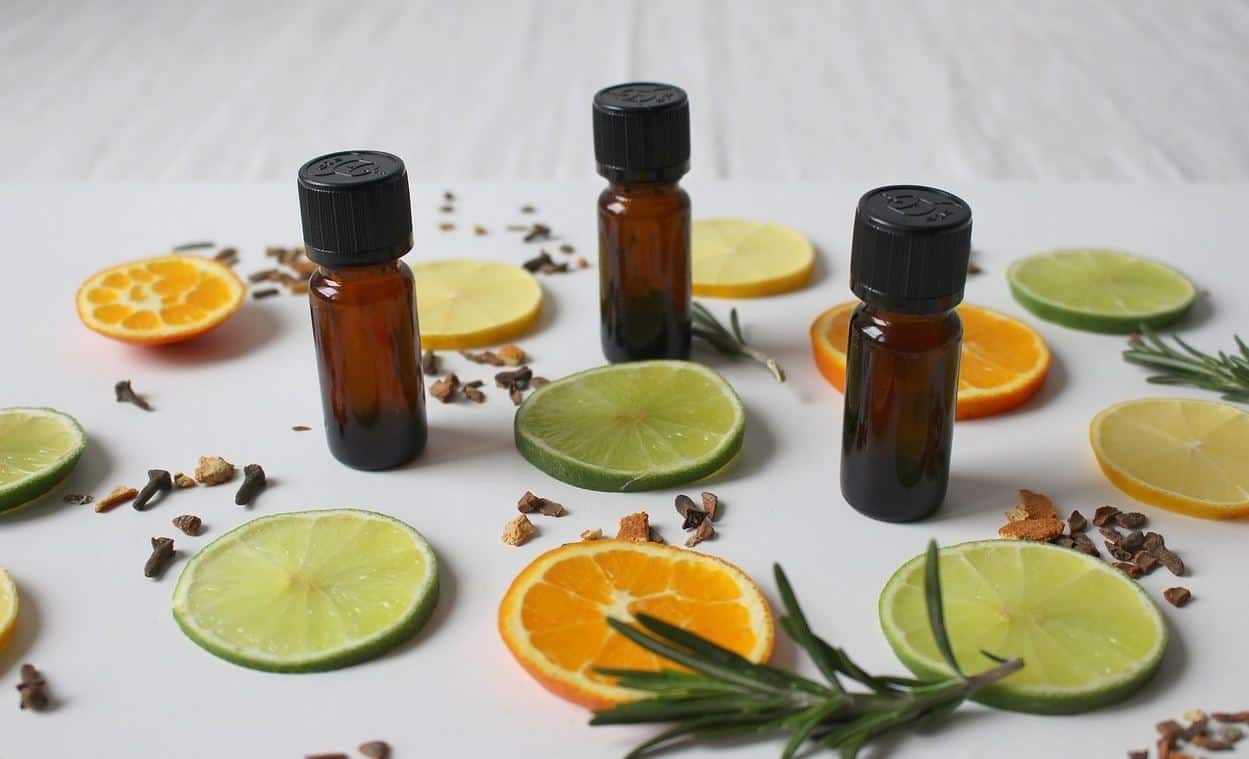 essential oil bottles with citrus slices
