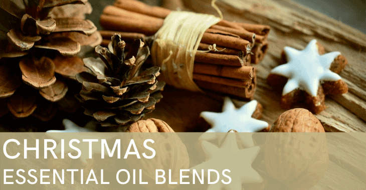 pine cones, cinnamon sticks, and cookies with text overlay "Christmas Essential Oil Blends"