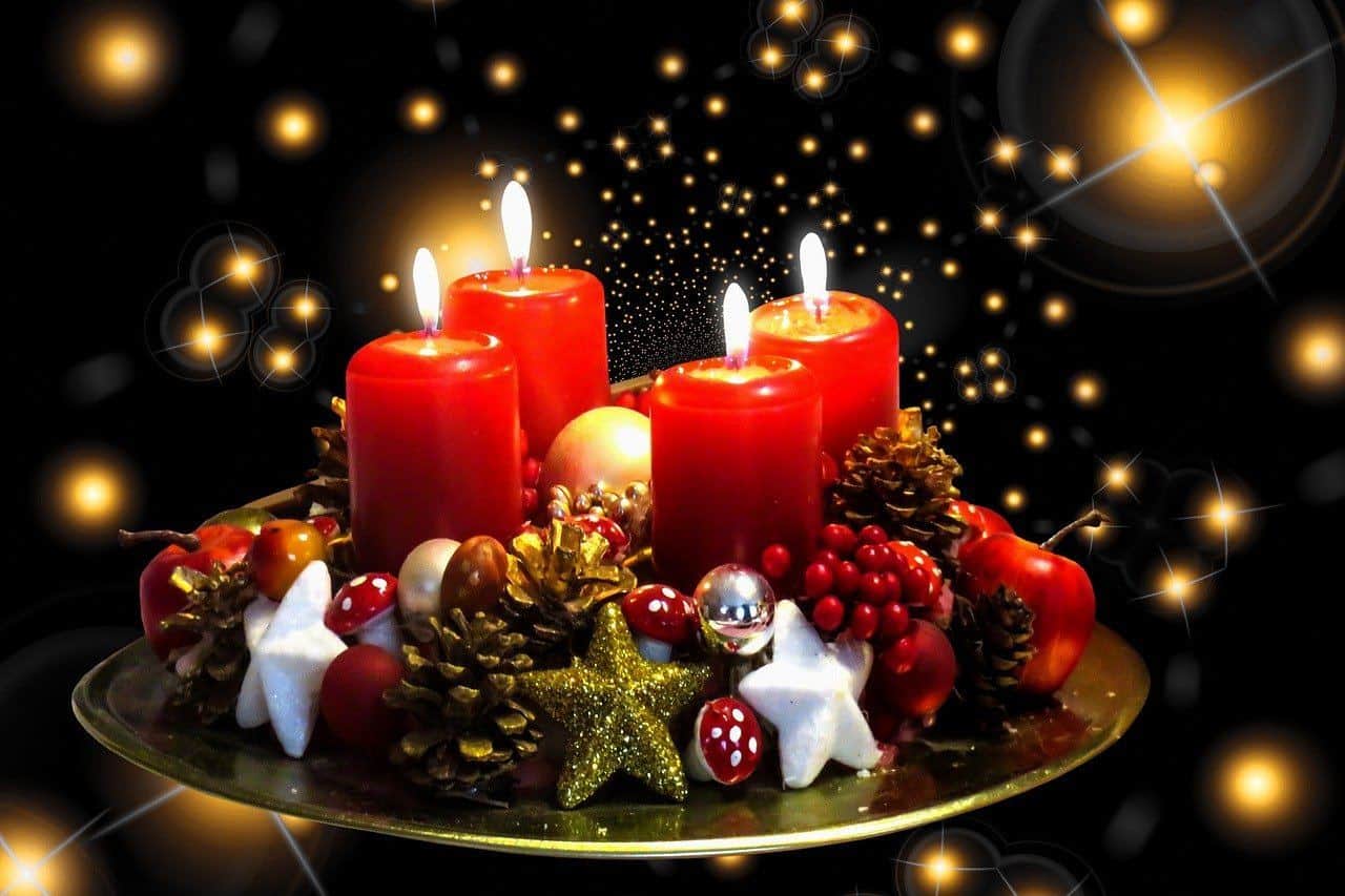 a Christmas themed centerpiece with candles